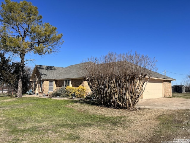 view of front facade with a garage and a front lawn