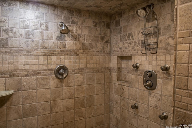 bathroom with a tile shower