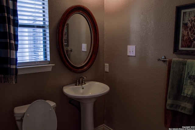 bathroom featuring toilet