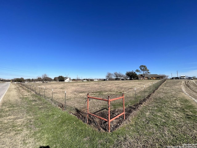 view of yard with a rural view