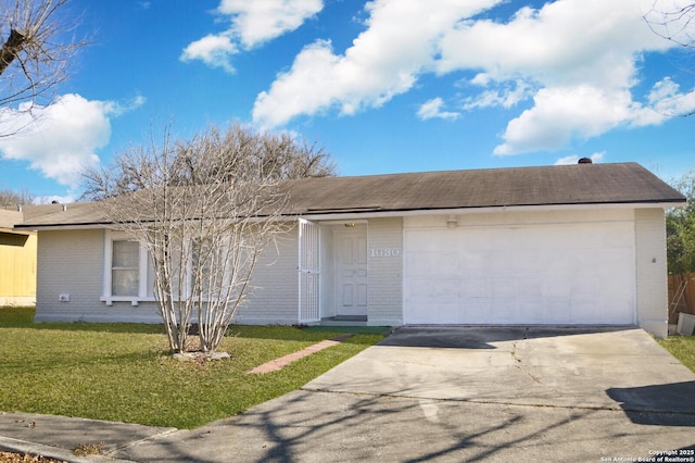 ranch-style house with a front lawn and a garage