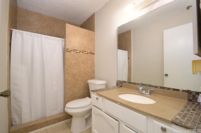 bathroom featuring toilet, vanity, walk in shower, tile patterned floors, and a textured ceiling