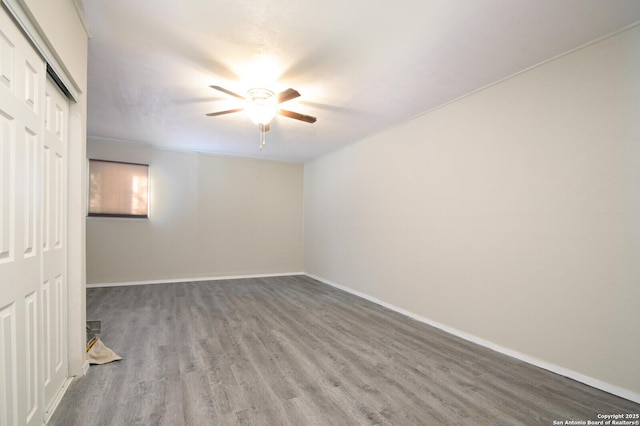 unfurnished room featuring ceiling fan and wood-type flooring