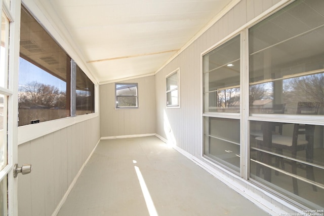 unfurnished sunroom with lofted ceiling and a wealth of natural light