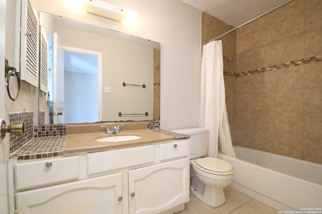 full bathroom featuring toilet, vanity, tile patterned flooring, and shower / bath combo