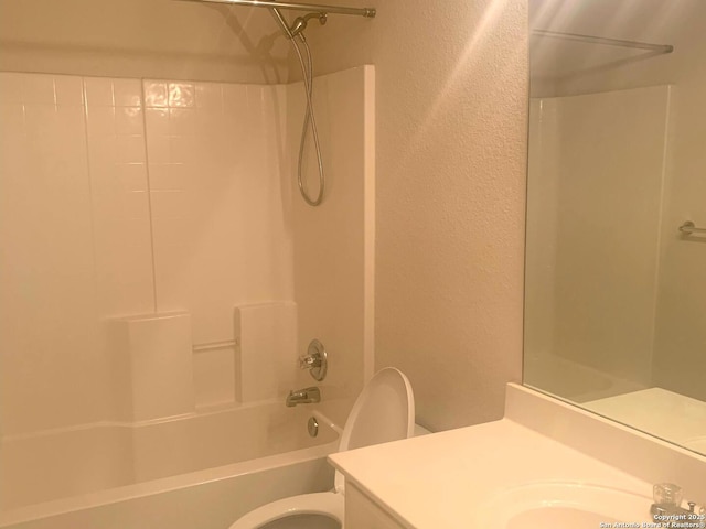 full bathroom featuring toilet, vanity, and shower / bathing tub combination