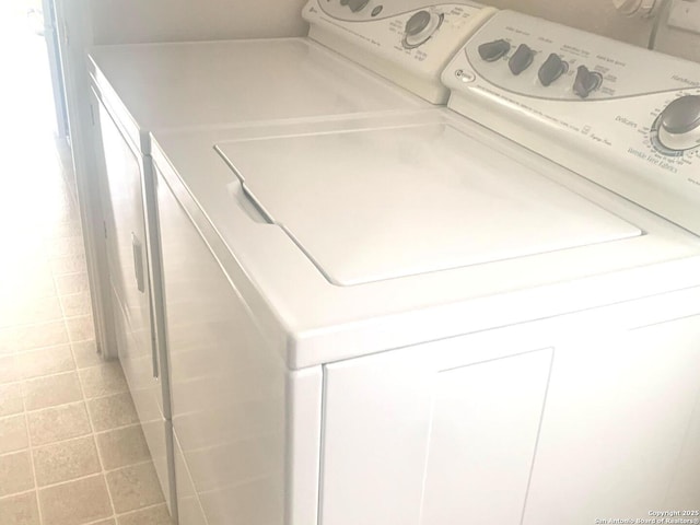 clothes washing area with separate washer and dryer