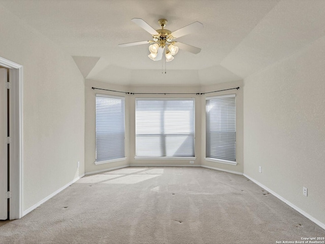 unfurnished room with ceiling fan and light colored carpet