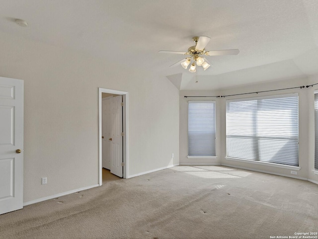 unfurnished room with ceiling fan and light carpet