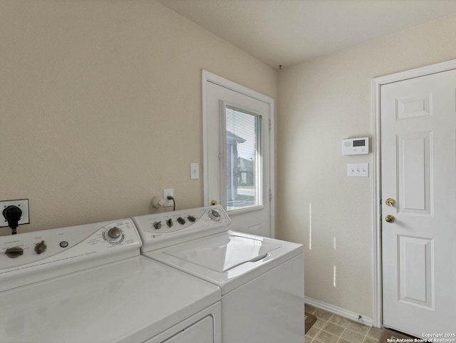 laundry room with washing machine and clothes dryer