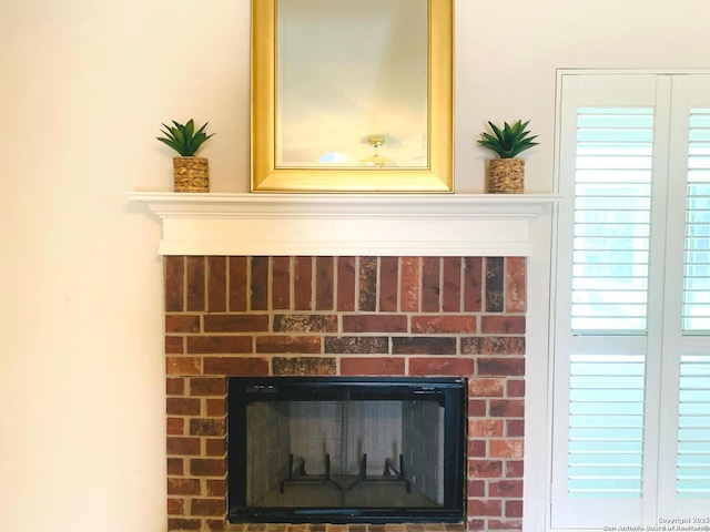 room details featuring a brick fireplace