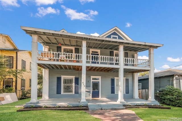 view of front facade featuring a porch and a balcony