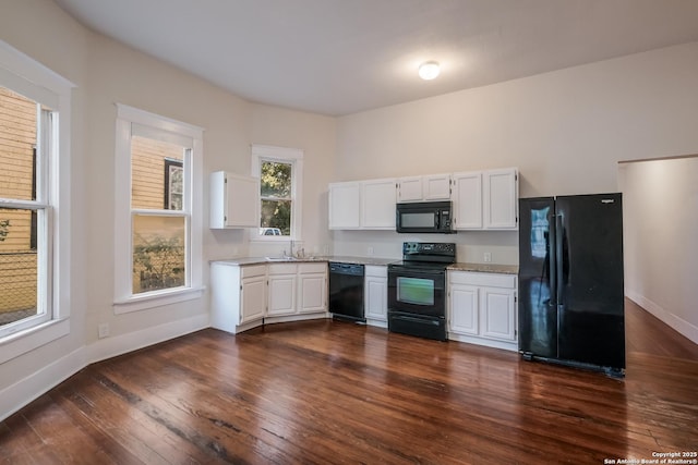 kitchen featuring black appliances, white cabinets, dark hardwood / wood-style flooring, and sink