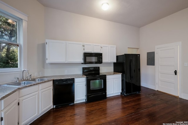 kitchen featuring white cabinets, black appliances, sink, dark hardwood / wood-style floors, and electric panel