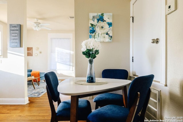 dining space featuring ceiling fan, plenty of natural light, and light hardwood / wood-style floors