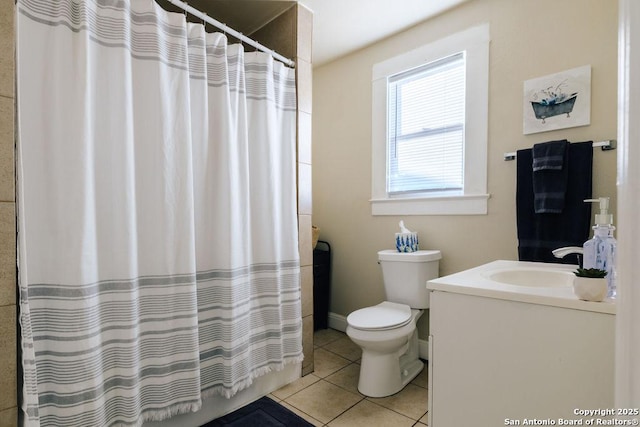 bathroom with toilet, tile patterned flooring, walk in shower, and vanity