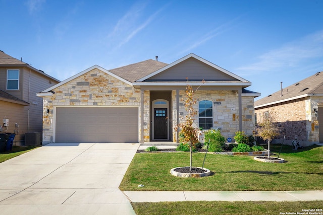 view of front of property with central AC unit, a garage, and a front yard