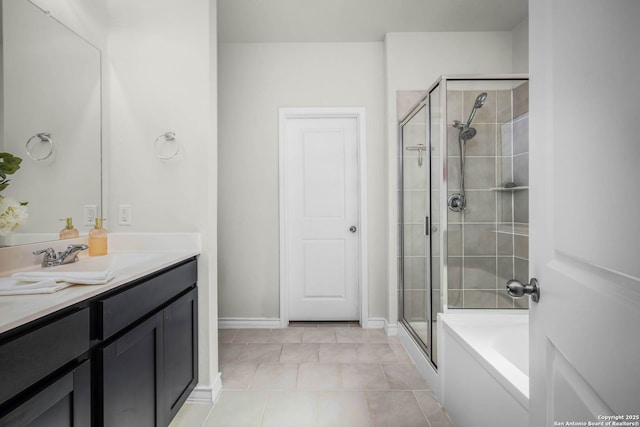 bathroom with tile patterned floors, vanity, and independent shower and bath