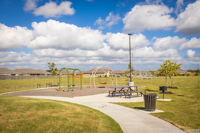 view of jungle gym with a lawn