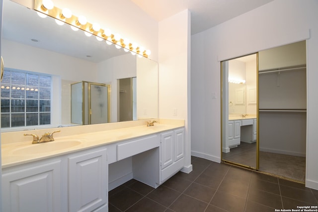 bathroom with vanity and tile patterned flooring