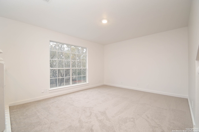 unfurnished room featuring carpet