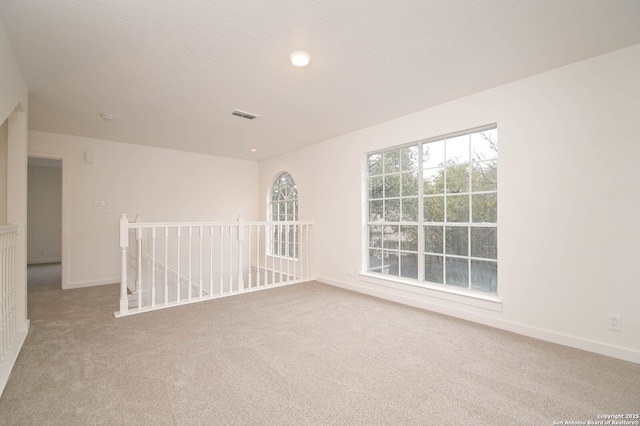 spare room with carpet floors