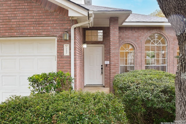 entrance to property featuring a garage