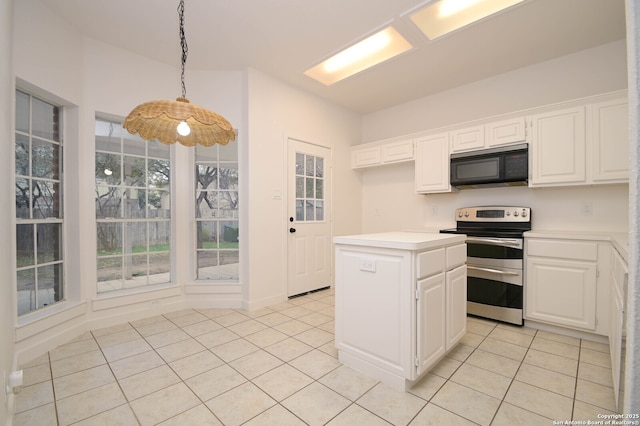 kitchen with double oven range, white cabinetry, hanging light fixtures, and a center island