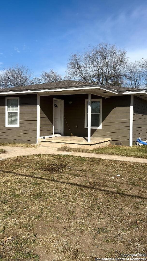 exterior space with a front lawn