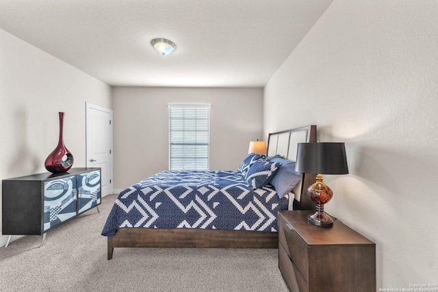 bedroom with light colored carpet