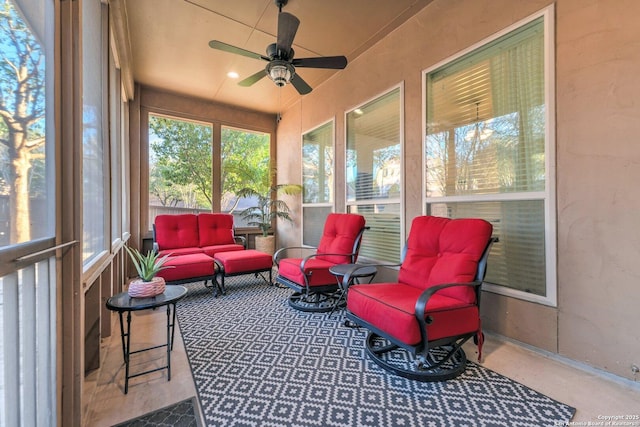 sunroom featuring ceiling fan