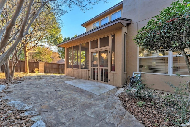 exterior space featuring a sunroom