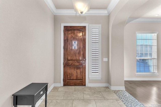 tiled foyer with crown molding