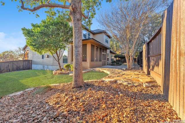 view of yard featuring a sunroom