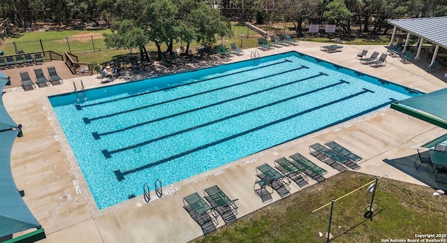 view of swimming pool with a patio