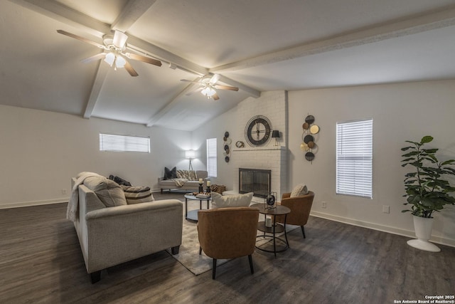 living room featuring a brick fireplace, dark hardwood / wood-style floors, lofted ceiling with beams, and ceiling fan