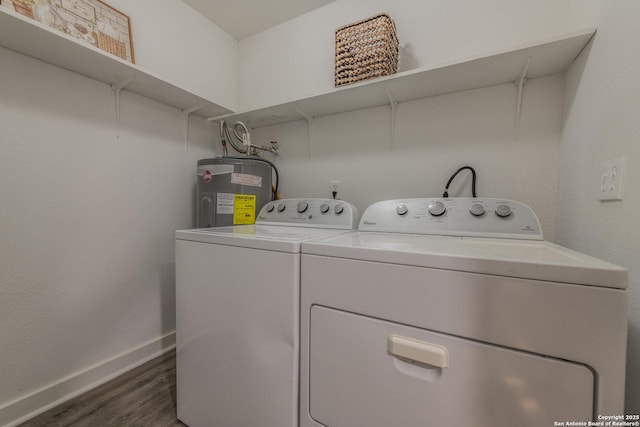 laundry room featuring water heater, dark hardwood / wood-style flooring, and washing machine and dryer