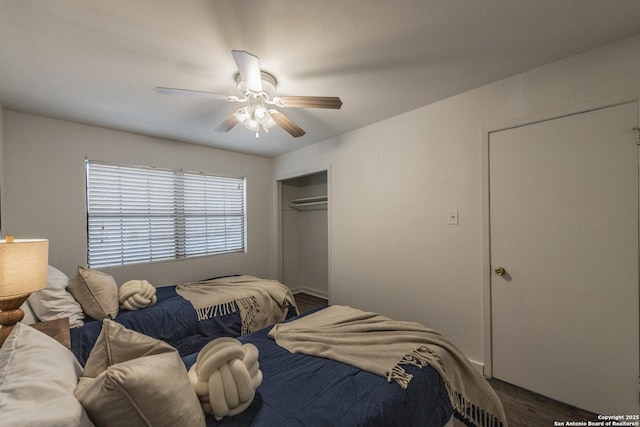 bedroom with ceiling fan, dark hardwood / wood-style flooring, and a closet