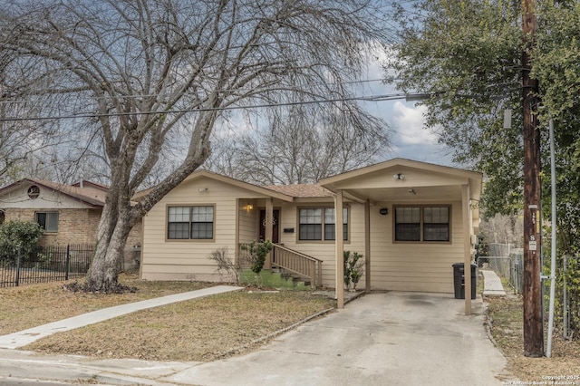 view of front of property with central AC unit and a carport