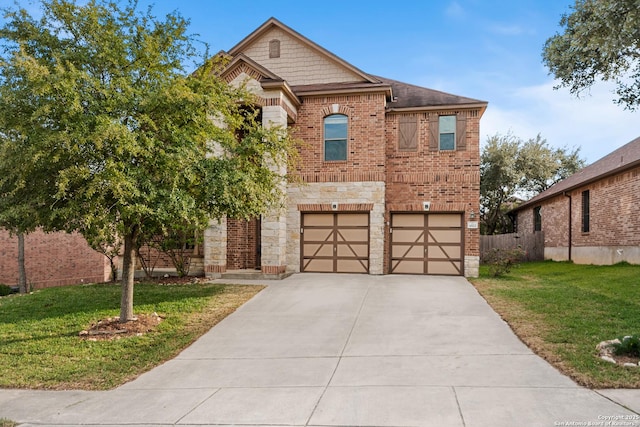 view of front of home with a garage and a front lawn