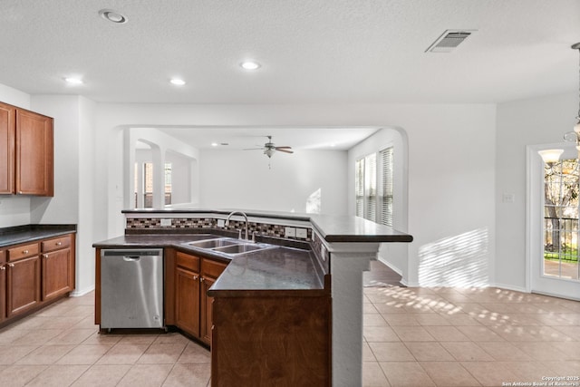 kitchen with light tile patterned floors, a center island with sink, ceiling fan, dishwasher, and sink