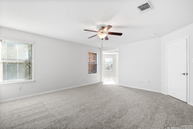 unfurnished room with ceiling fan and carpet flooring