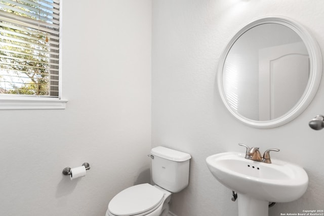 bathroom featuring toilet and sink