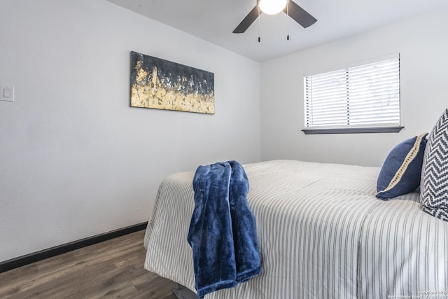 bedroom with ceiling fan and dark wood-type flooring