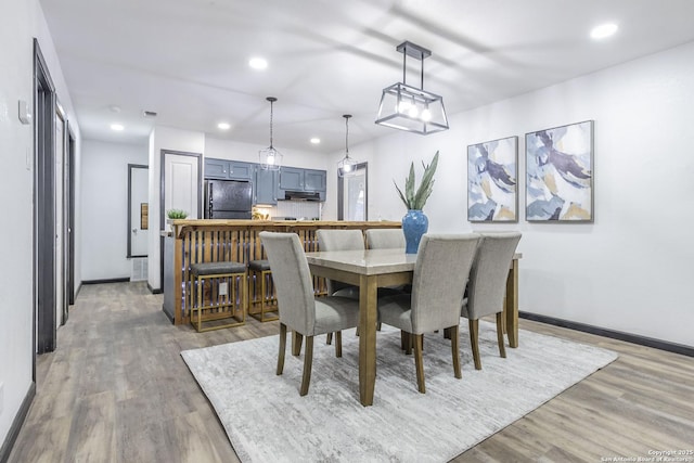 dining area with wood-type flooring