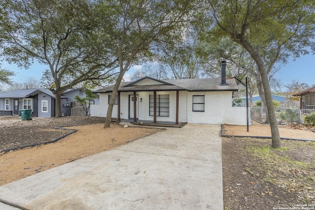 ranch-style house featuring covered porch