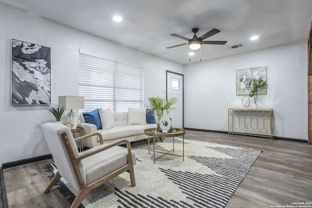 living room with ceiling fan and hardwood / wood-style flooring