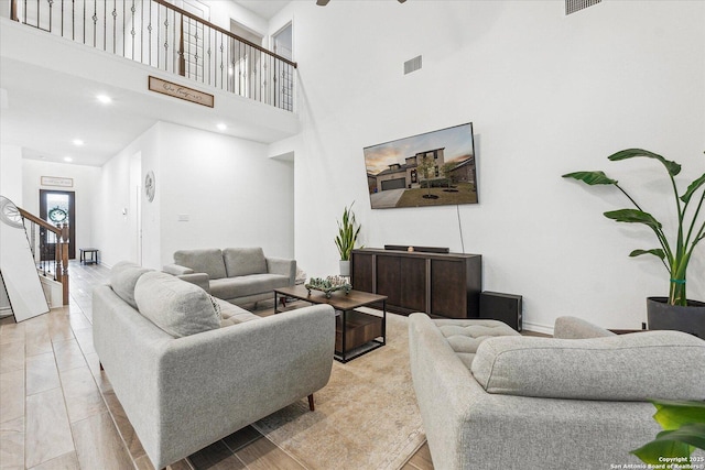 living room with a towering ceiling