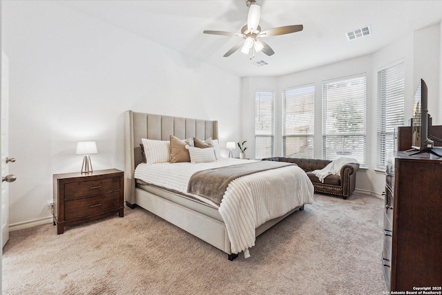 bedroom with light carpet and ceiling fan