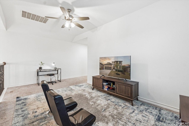 carpeted living room with ceiling fan